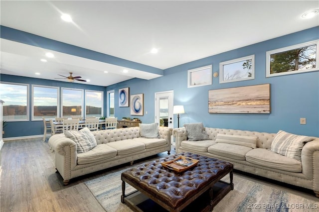 living room with wood finished floors, ceiling fan, recessed lighting, and baseboards