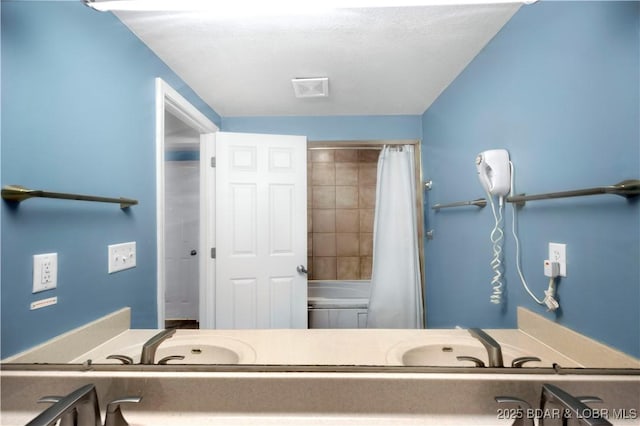 bathroom with a bath, a shower with curtain, and a sink