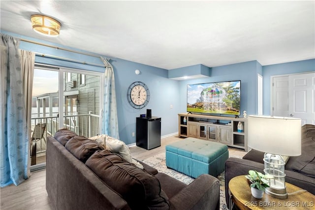 living room with wood finished floors and baseboards