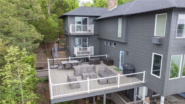 back of house featuring a chimney, outdoor dining space, a deck, an outdoor living space, and stairs