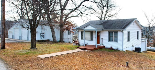 view of front of home with roof with shingles and central AC unit