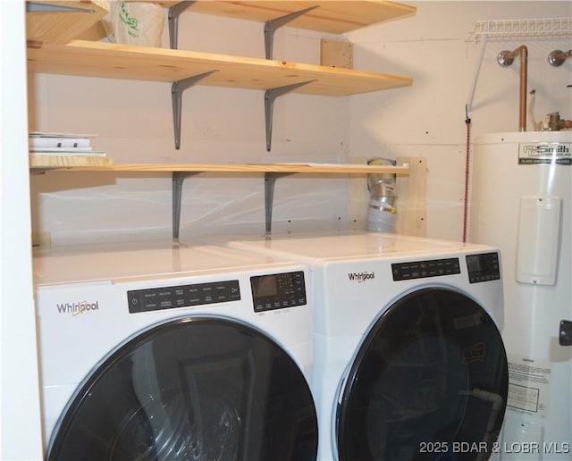 washroom featuring electric water heater and separate washer and dryer