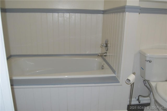 full bath featuring toilet and a bathtub