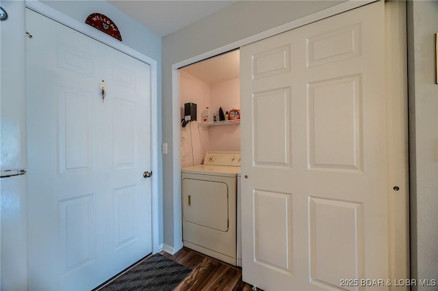 clothes washing area featuring washer / clothes dryer and dark wood-style flooring