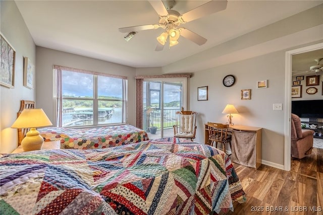 bedroom with access to outside, wood finished floors, baseboards, and ceiling fan