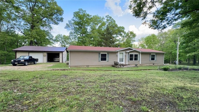 29745 Canary Rd, Gravois Mills, MO 65037 - view of front of property with crawl space, a garage, a front lawn, an outbuilding, and driveway
