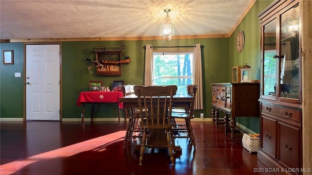29745 Canary Rd, Gravois Mills, MO 65037 - dining space featuring a textured ceiling, wood finished floors, baseboards, and ornamental molding