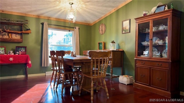 29745 Canary Rd, Gravois Mills, MO 65037 - dining room featuring crown molding, wood finished floors, a textured ceiling, and baseboards