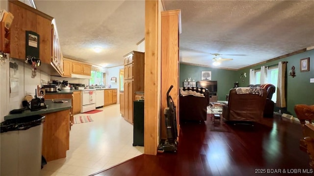 29745 Canary Rd, Gravois Mills, MO 65037 - kitchen with white appliances, dark countertops, a textured ceiling, open floor plan, and a ceiling fan