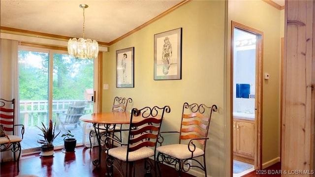 29745 Canary Rd, Gravois Mills, MO 65037 - dining area with crown molding, a chandelier, lofted ceiling, and wood finished floors