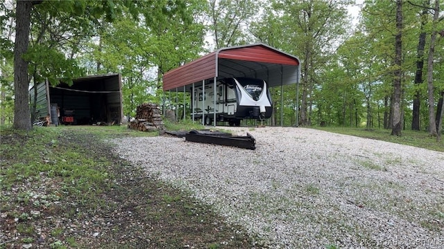 29745 Canary Rd, Gravois Mills, MO 65037 - view of yard with a carport and gravel driveway