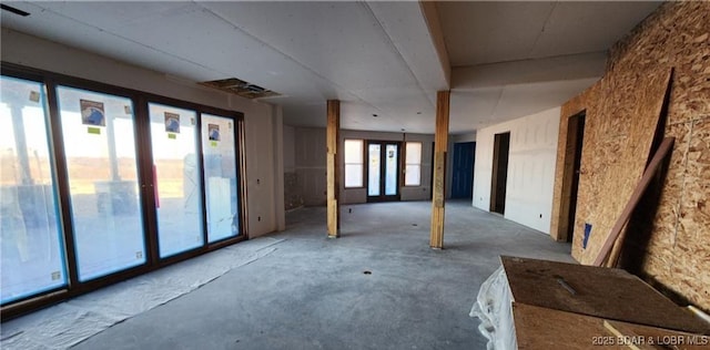 25455 Rail Rd, Richland, MO 65556 - empty room with french doors and concrete floors