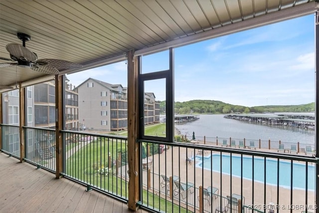 unfurnished sunroom with a water view