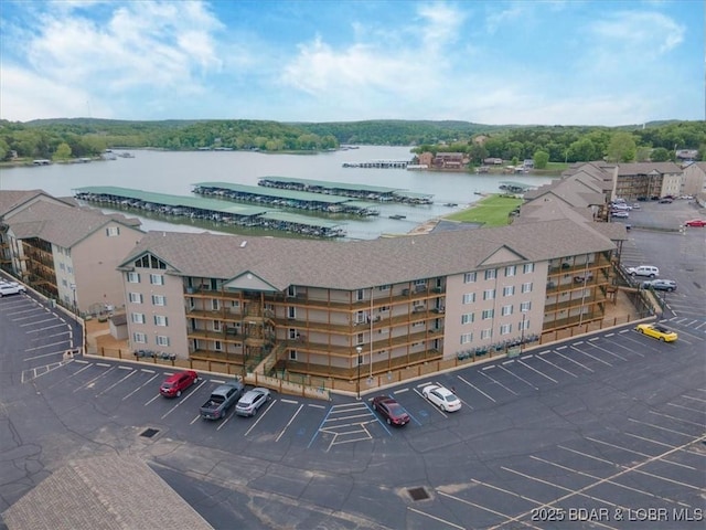 aerial view of apartment complex / building and a large body of water