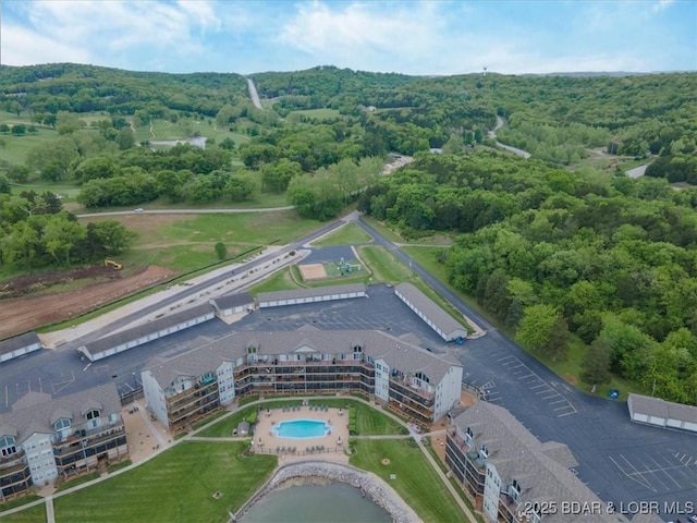 aerial overview of property's location featuring a forest