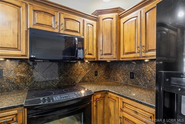 kitchen featuring black appliances, brown cabinets, and backsplash