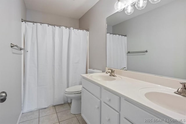 full bath with toilet, tile patterned flooring, double vanity, baseboards, and a shower with shower curtain