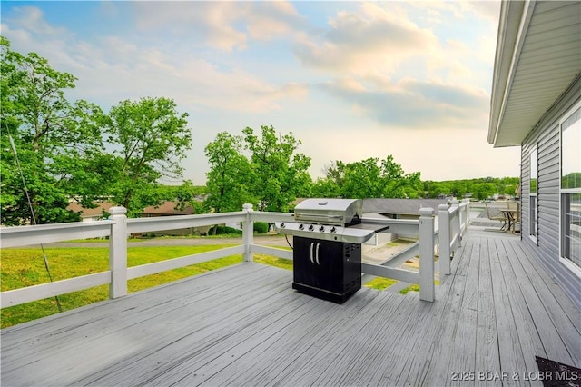 35 Teak Village Dr, Lake Ozark, MO 65049 - wooden deck featuring a lawn and a grill