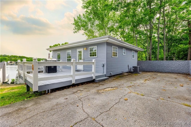 35 Teak Village Dr, Lake Ozark, MO 65049 - rear view of property featuring a deck, central AC, and a patio area