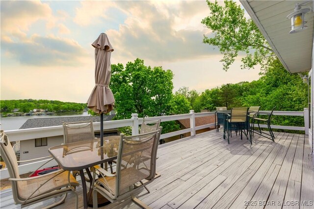 35 Teak Village Dr, Lake Ozark, MO 65049 - wooden terrace with outdoor dining space and a water view