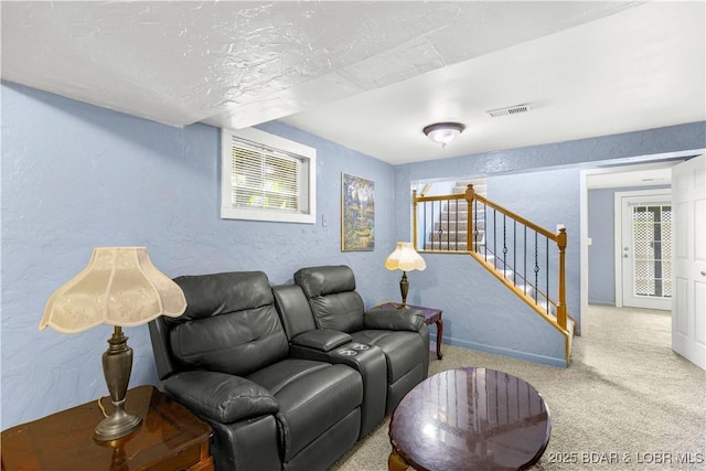 35 Teak Village Dr, Lake Ozark, MO 65049 - carpeted living room with a textured wall, stairway, and baseboards