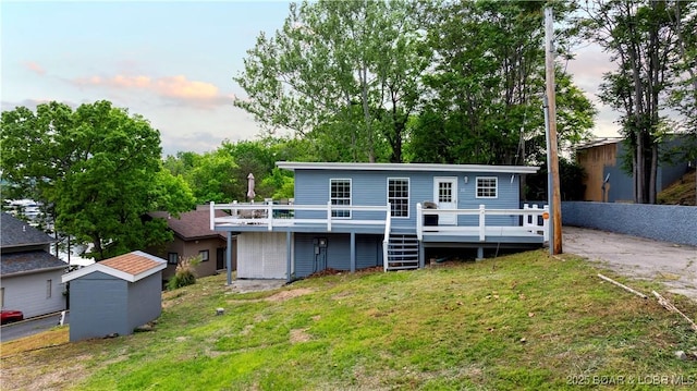 35 Teak Village Dr, Lake Ozark, MO 65049 - back of house featuring a wooden deck and a yard