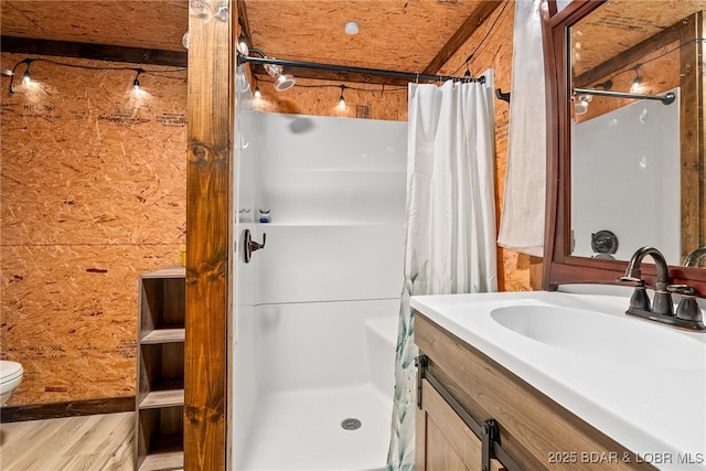 108 Frazier Oaks Rd, Eldon, MO 65026 - full bath featuring a stall shower, vanity, toilet, and wood finished floors