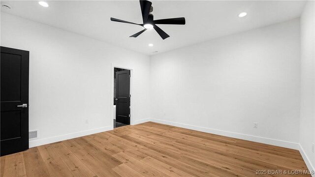 unfurnished bedroom featuring baseboards, recessed lighting, light wood-style flooring, and ceiling fan