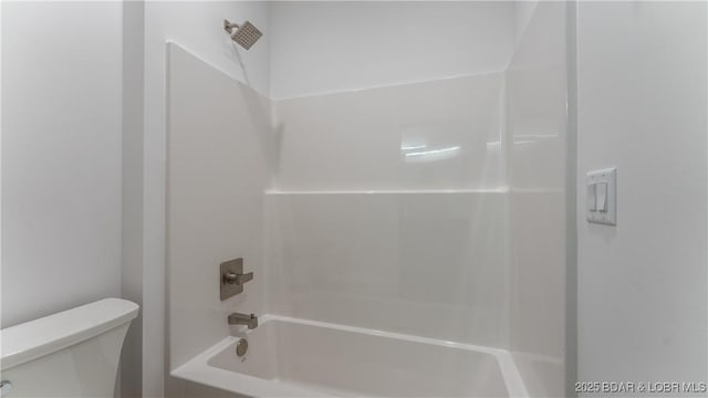 bathroom with toilet and shower / bathtub combination