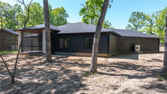 view of side of property with a sunroom