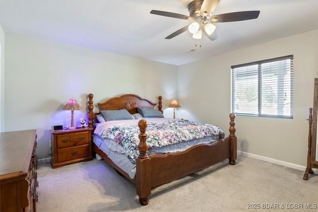 carpeted bedroom featuring baseboards and ceiling fan