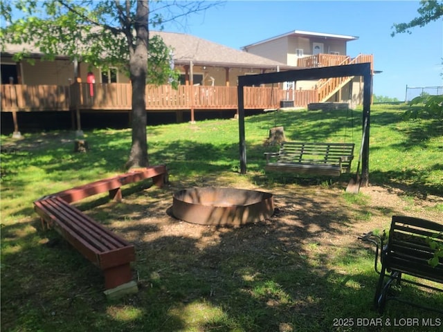 98 Storage Rd, Eldon, MO 65026 - view of grassy yard with a wooden deck