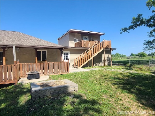 98 Storage Rd, Eldon, MO 65026 - rear view of house featuring stairs, a deck, and a shingled roof