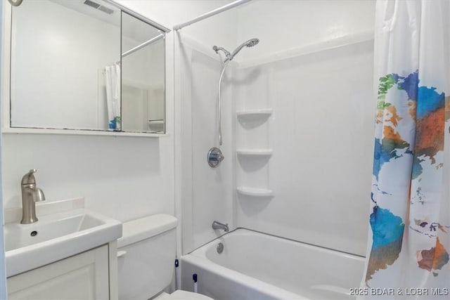 full bath with shower / bath combo, toilet, and vanity