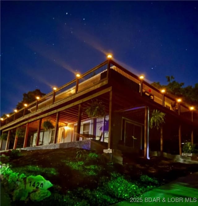 view of back of house at twilight