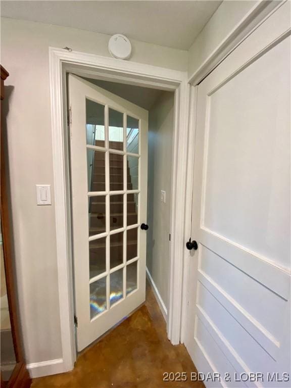 doorway to outside featuring concrete flooring