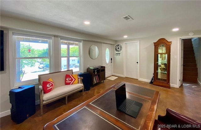living area with recessed lighting and baseboards