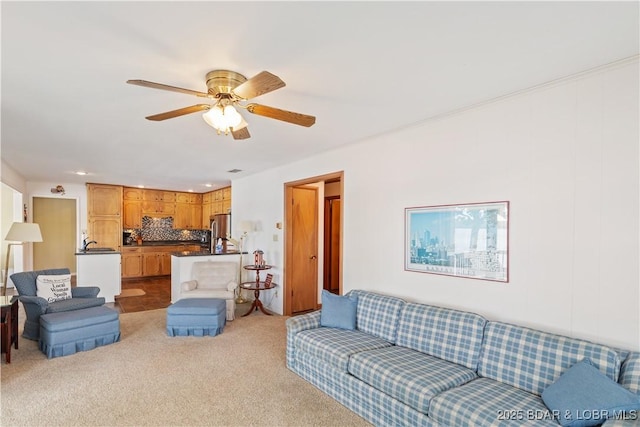 living room featuring carpet, a ceiling fan, and recessed lighting