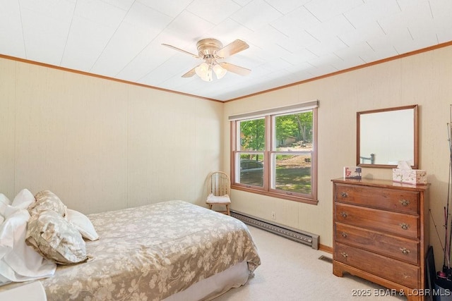 carpeted bedroom featuring a baseboard radiator, ornamental molding, and a ceiling fan