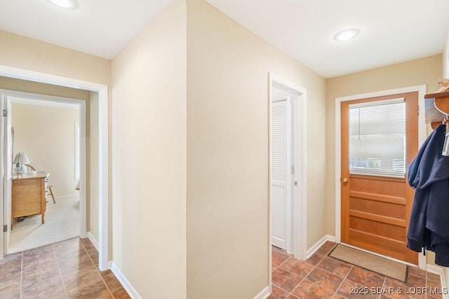corridor with baseboards and recessed lighting
