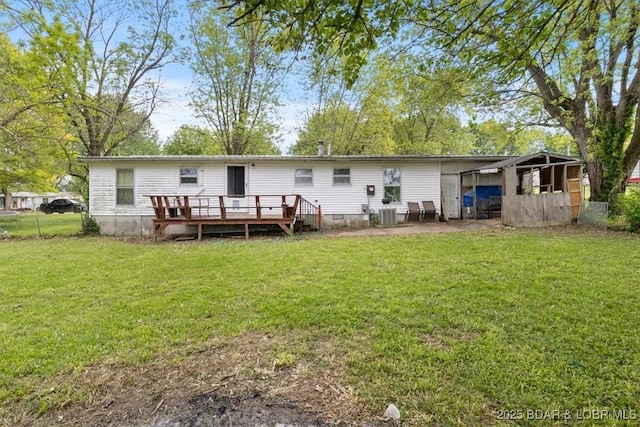rear view of house featuring a deck