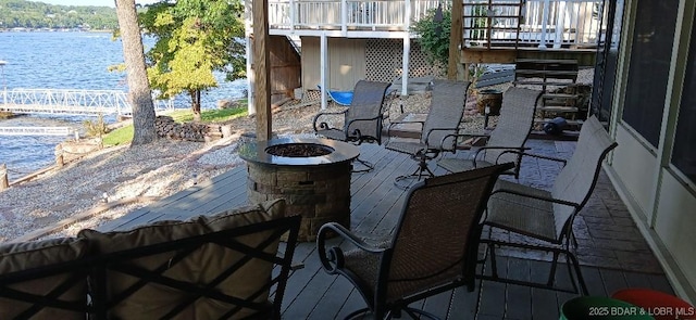 50 Shannon Cir, Sunrise Beach, MO 65079 - wooden terrace featuring a water view and an outdoor fire pit