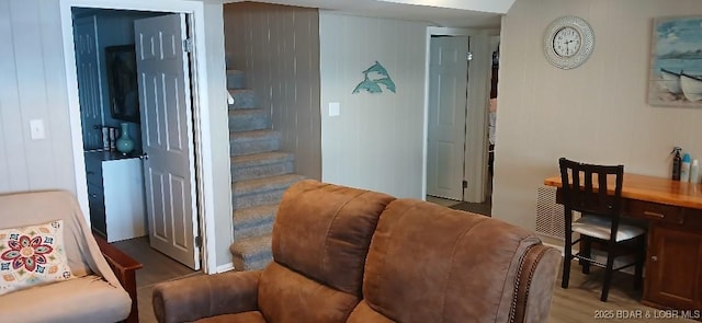 50 Shannon Cir, Sunrise Beach, MO 65079 - living area featuring stairs, wood finished floors, and wooden walls