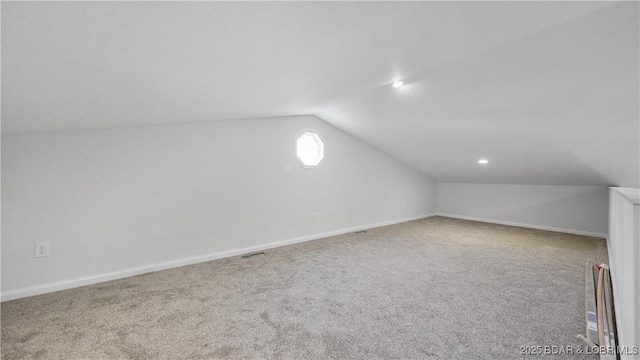 additional living space with lofted ceiling, carpet flooring, baseboards, and recessed lighting