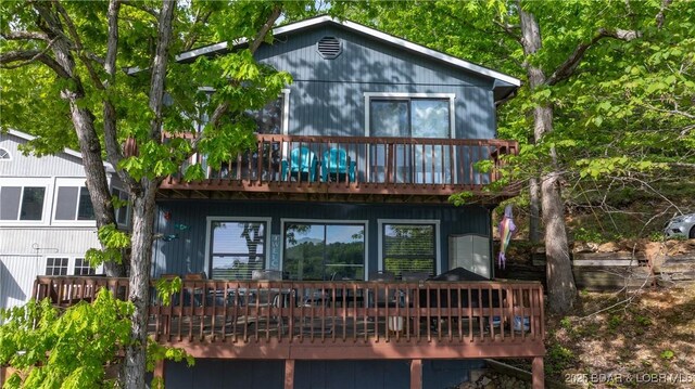 26505 Mesa Dr, Rocky Mount, MO 65072 - back of property featuring a wooden deck