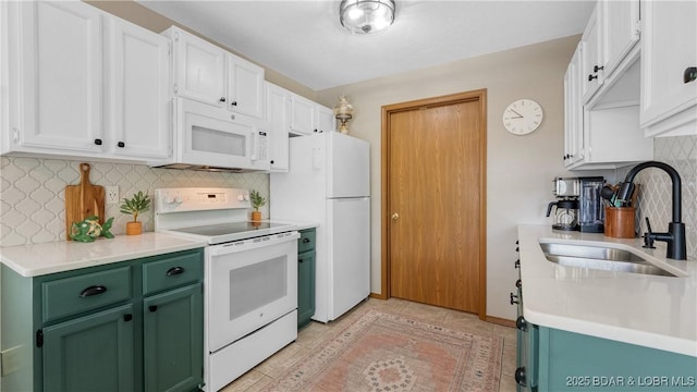 26505 Mesa Dr, Rocky Mount, MO 65072 - kitchen featuring white appliances, green cabinetry, a sink, backsplash, and light countertops