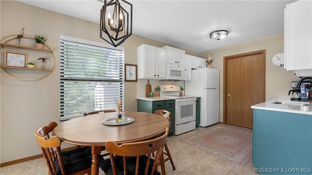 26505 Mesa Dr, Rocky Mount, MO 65072 - kitchen featuring white appliances, a sink, light countertops, white cabinetry, and light tile patterned floors