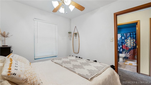 26505 Mesa Dr, Rocky Mount, MO 65072 - carpeted bedroom with ensuite bath and a ceiling fan