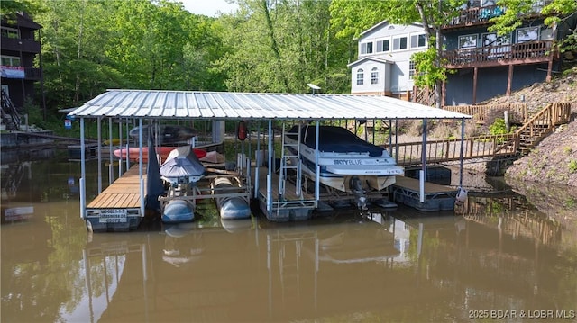26505 Mesa Dr, Rocky Mount, MO 65072 - dock featuring boat lift and a water view