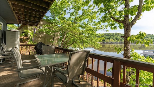 26505 Mesa Dr, Rocky Mount, MO 65072 - wooden terrace with a water view and outdoor dining space